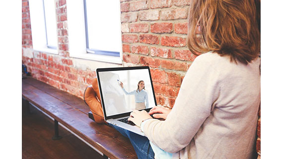 Student Watching Video On Laptop